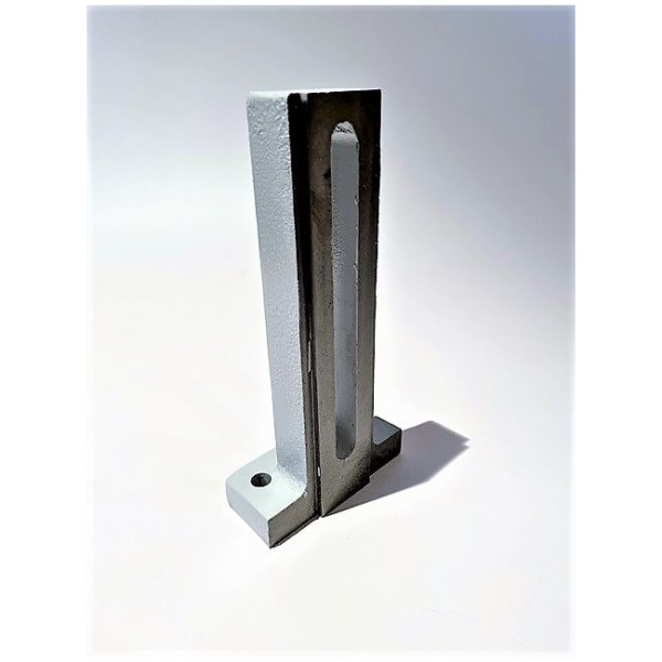 A vertical Leadermac Side Pressure Casting (Part No. 0005) with an elongated slot in the middle and a base featuring a single circular hole sits on a white surface. This bracket combines a silver metallic side with a darker, possibly painted, side. Shadows are cast on the right side of the image.